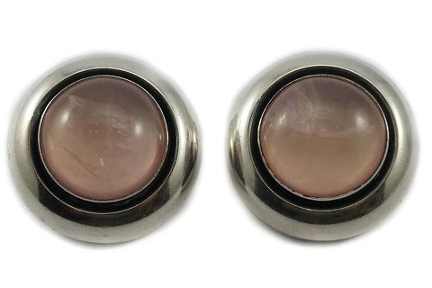N. E. From; A pair of ear clips of sterling silver with rose quartz