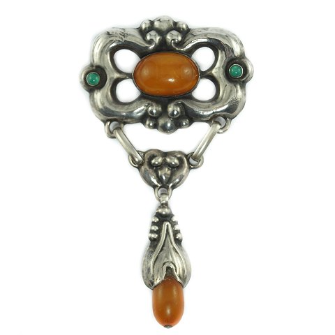 E. L. Weimann; a jugend brooch of silver with amber and chrysoprases