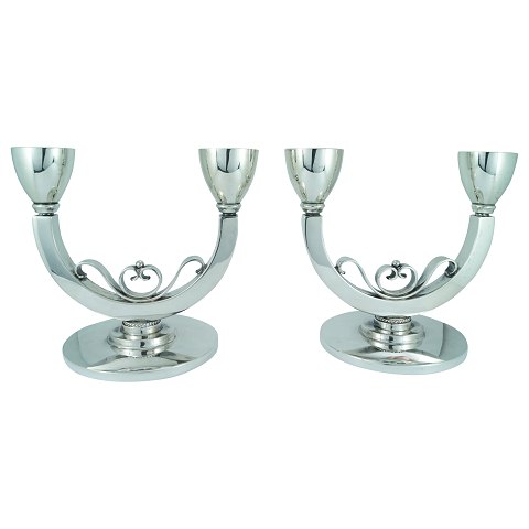 L. Berth; A pair of candlesticks of hallmarked silver