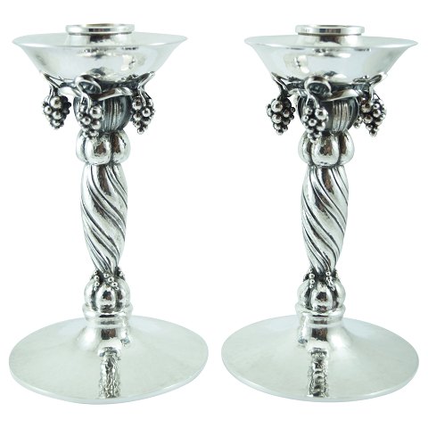 Georg Jensen; A pair of "Grape" candlesticks in sterling silver
