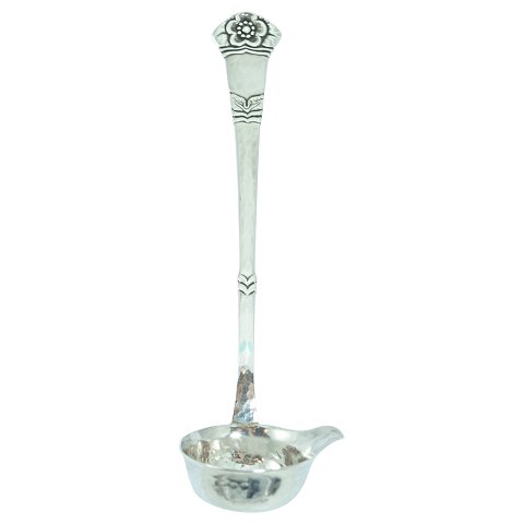 "Anemone" silver cutlery; A cream ladle of hallmarked silver