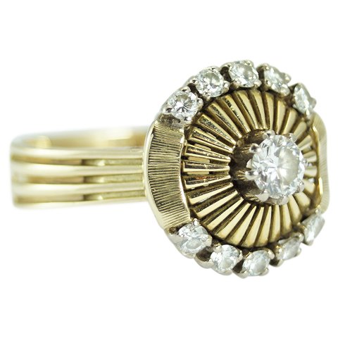 A brillant ring mounted in 14k gold and white gold