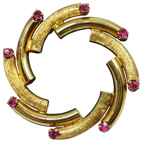 A ruby brooch mounted in 18k gold