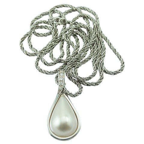Ole Lynggaard; A pendant of 14k white gold set with a mabé pearl and diamonds