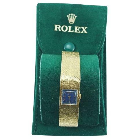 Rolex; Dameur af 18 kt. guld med blå urskive