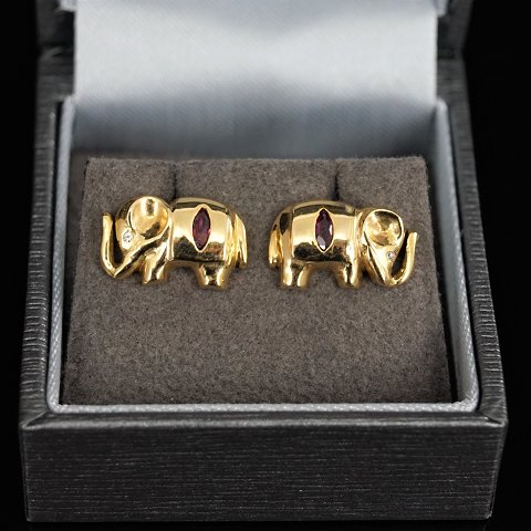 A pair of elephant earrings set with rubies and diamonds, mounted in 18k gold
