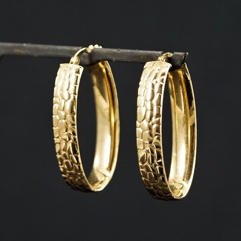 Store ørestikker/øreringe af 14 kt. guld med mønster