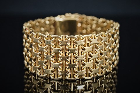 A wide bracelet of 18k gold, Swedish