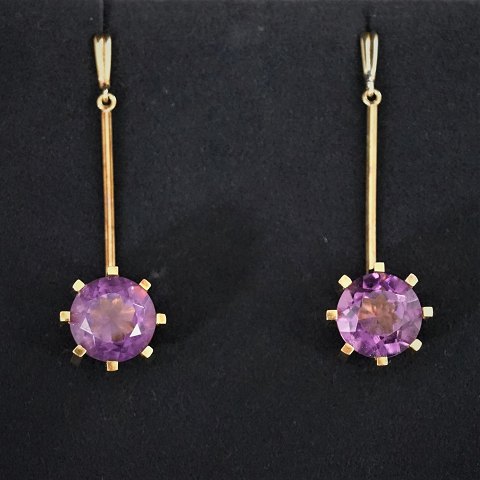 Earrings of 14k gold set with an amethyst