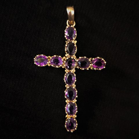 A pendant set with amethyst, mounted in 14k gold