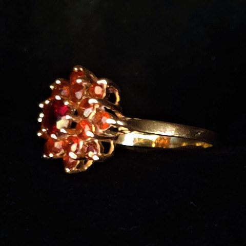 A ring of 14k gold with granates