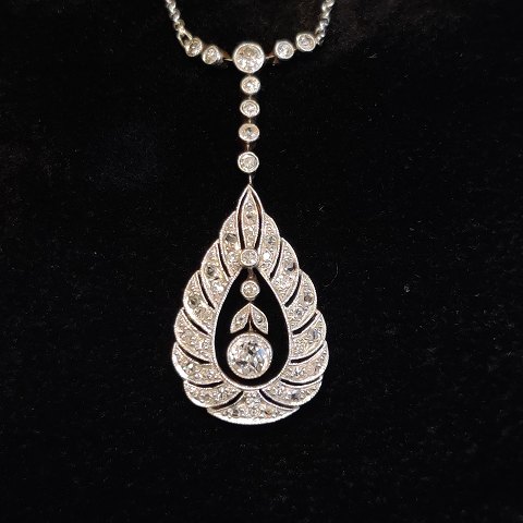 An art deco diamond necklace mounted in 14k gold and white gold