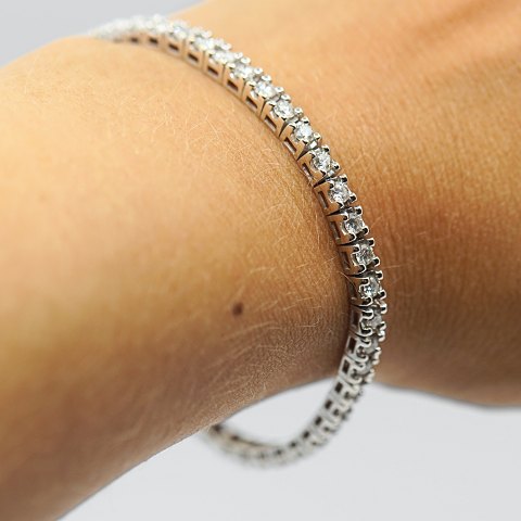 Klaus Rygaard; A tennis bracelet in 14k white gold with diamonds