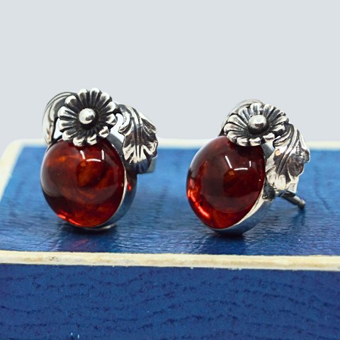 N. E. From; A pair of amber ear rings set in sterling silver