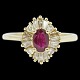 A ring of 18k gold set with a ruby and diamonds