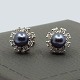 C. Antonsen; Pair of earrings of 18k white gold set with pearl and diamonds