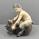 Royal Copenhagen; Figurine of porcelain, a faun with a bear #648